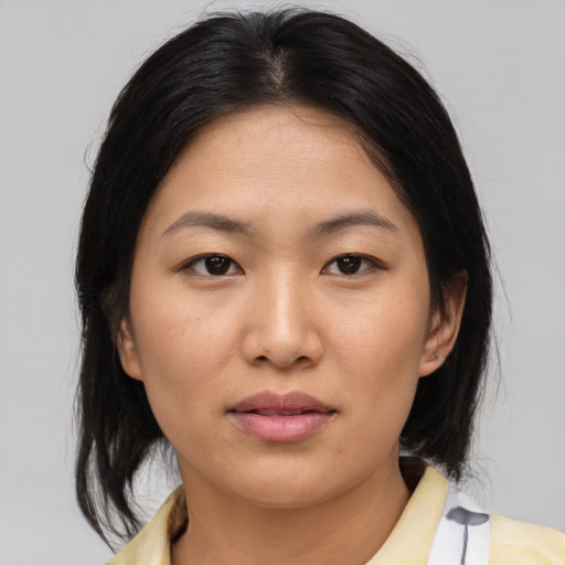 Neutral asian young-adult female with medium  brown hair and brown eyes