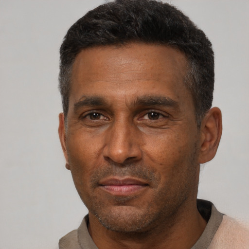 Neutral latino adult male with short  black hair and brown eyes