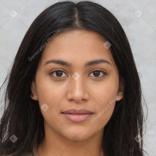 Joyful latino young-adult female with long  brown hair and brown eyes