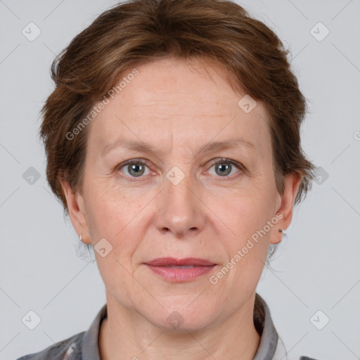 Joyful white adult female with short  brown hair and grey eyes