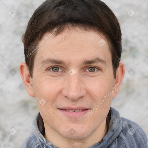 Joyful white adult male with short  brown hair and grey eyes