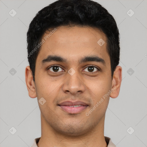 Joyful latino young-adult male with short  black hair and brown eyes