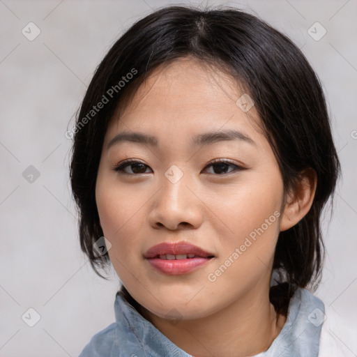 Joyful asian young-adult female with medium  black hair and brown eyes