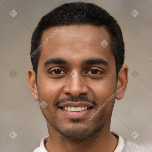 Joyful black young-adult male with short  black hair and brown eyes