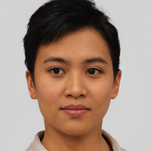 Joyful asian young-adult female with short  brown hair and brown eyes