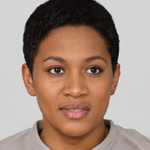 Joyful black young-adult female with short  brown hair and brown eyes