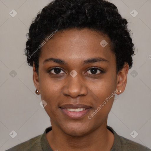 Joyful black young-adult female with short  black hair and brown eyes