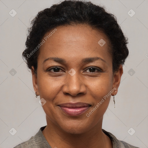 Joyful black adult female with short  brown hair and brown eyes