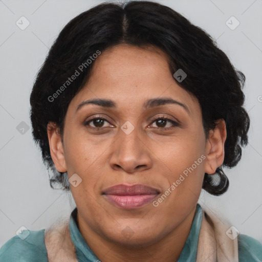 Joyful latino adult female with medium  brown hair and brown eyes