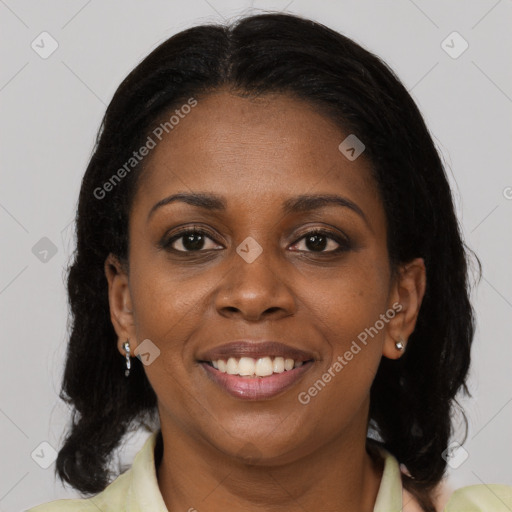 Joyful black young-adult female with medium  brown hair and brown eyes