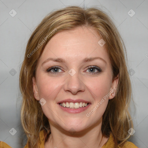 Joyful white young-adult female with medium  brown hair and blue eyes