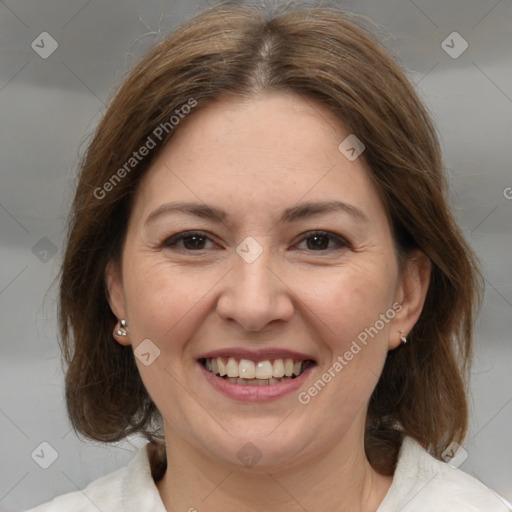 Joyful white adult female with medium  brown hair and brown eyes