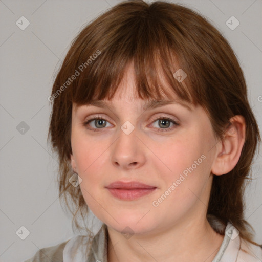 Joyful white young-adult female with medium  brown hair and blue eyes