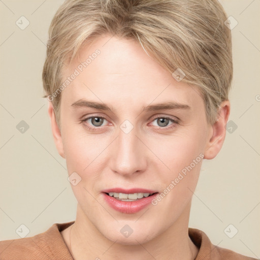 Joyful white young-adult female with short  brown hair and grey eyes