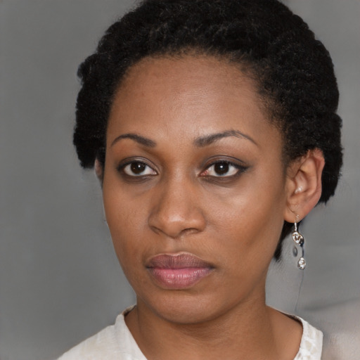 Neutral black young-adult female with short  brown hair and brown eyes