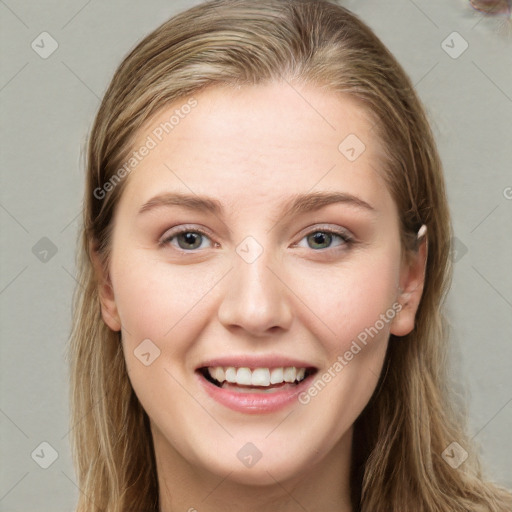 Joyful white young-adult female with long  brown hair and blue eyes