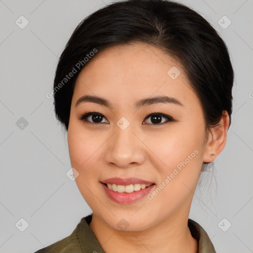 Joyful asian young-adult female with medium  brown hair and brown eyes