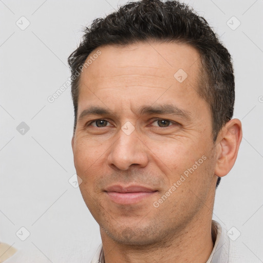 Joyful white adult male with short  brown hair and brown eyes