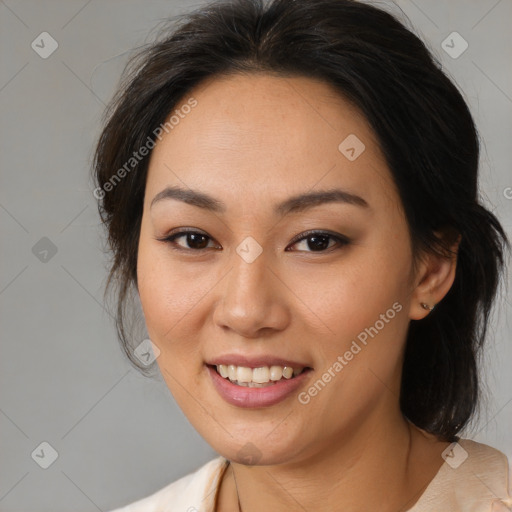 Joyful latino young-adult female with medium  brown hair and brown eyes