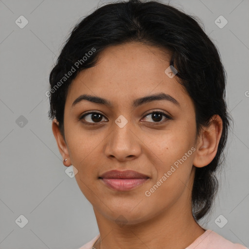 Joyful latino young-adult female with medium  black hair and brown eyes