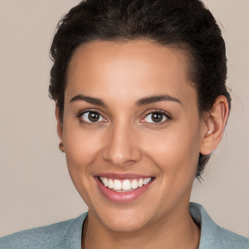 Joyful white young-adult female with short  brown hair and brown eyes