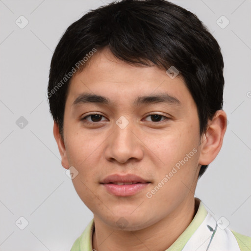 Joyful asian young-adult male with short  brown hair and brown eyes