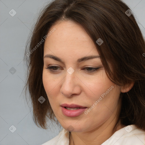 Joyful white adult female with medium  brown hair and brown eyes