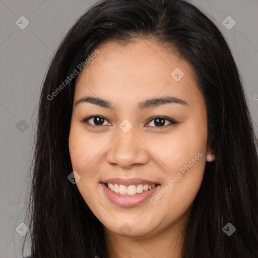 Joyful asian young-adult female with long  brown hair and brown eyes