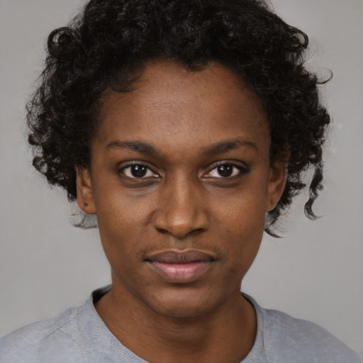 Neutral black young-adult female with short  brown hair and brown eyes