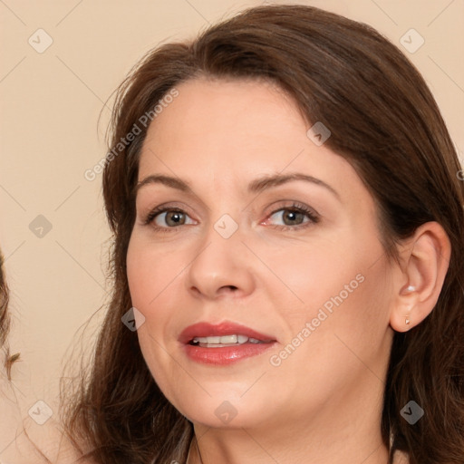 Joyful white adult female with medium  brown hair and brown eyes