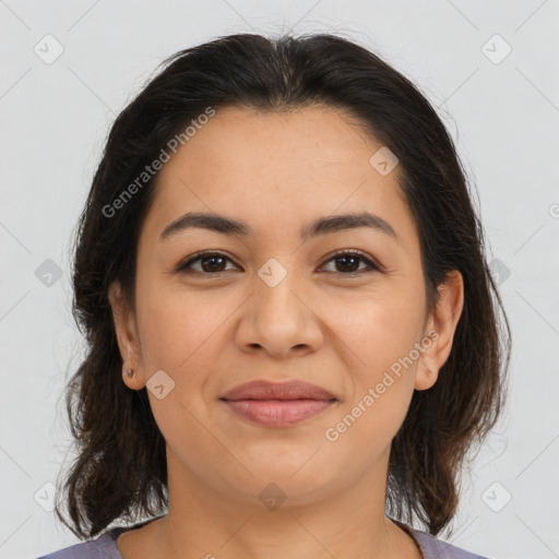 Joyful latino young-adult female with medium  brown hair and brown eyes