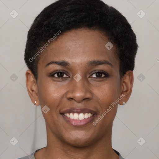 Joyful black young-adult female with short  black hair and brown eyes