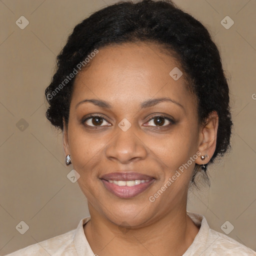 Joyful black adult female with short  brown hair and brown eyes