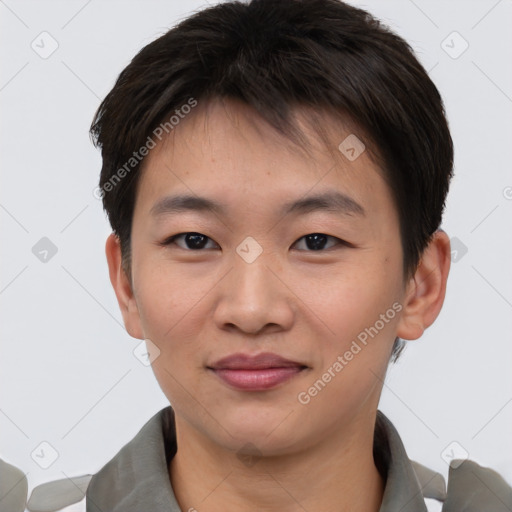 Joyful asian young-adult male with short  brown hair and brown eyes