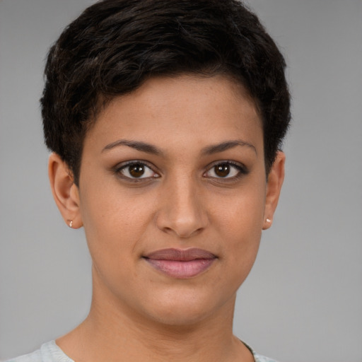 Joyful latino young-adult female with short  brown hair and brown eyes
