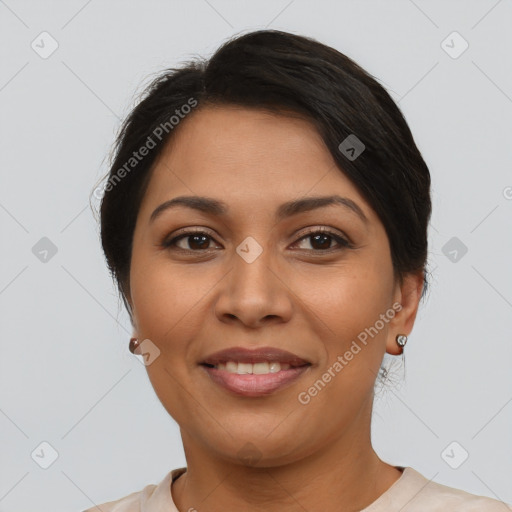 Joyful latino young-adult female with short  brown hair and brown eyes