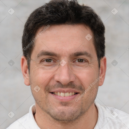 Joyful white adult male with short  brown hair and brown eyes