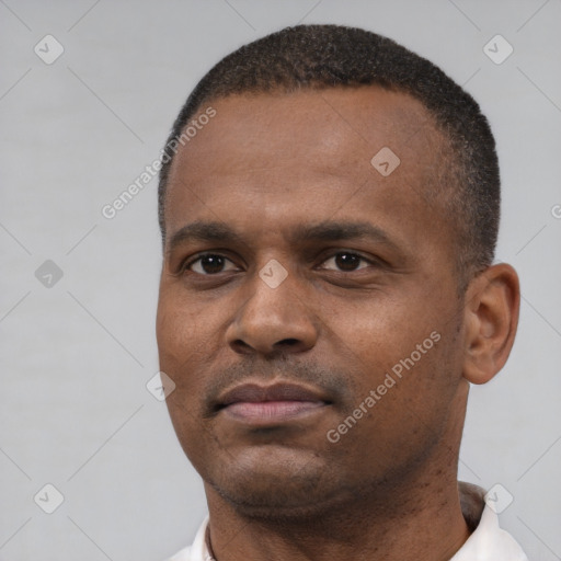 Neutral black young-adult male with short  black hair and brown eyes