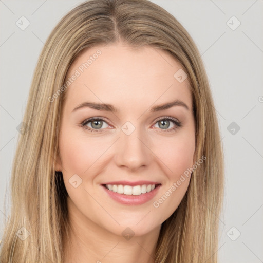 Joyful white young-adult female with long  brown hair and green eyes