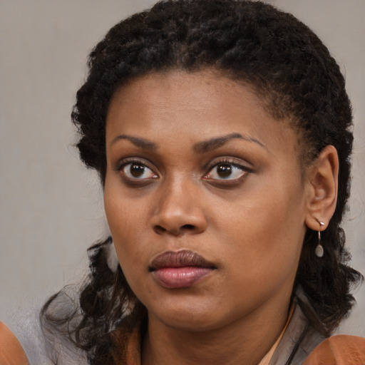Neutral black young-adult female with medium  black hair and brown eyes