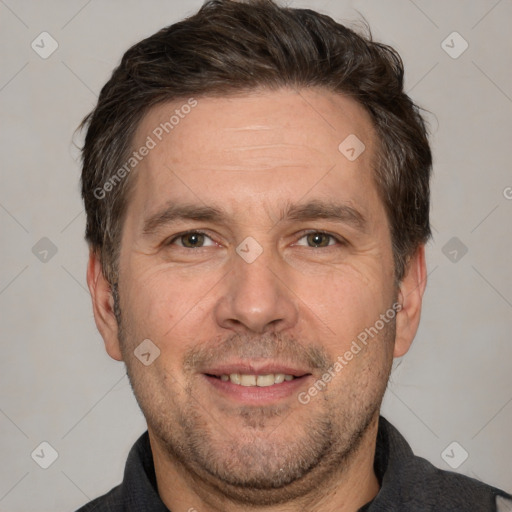 Joyful white adult male with short  brown hair and brown eyes