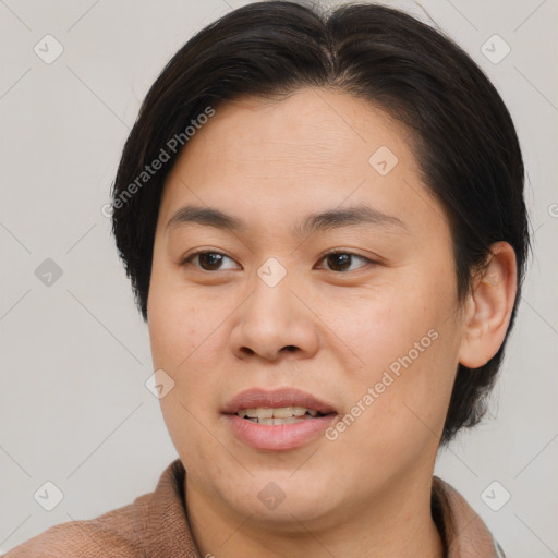 Joyful asian young-adult female with short  brown hair and brown eyes