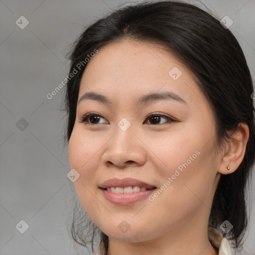 Joyful asian young-adult female with long  brown hair and brown eyes