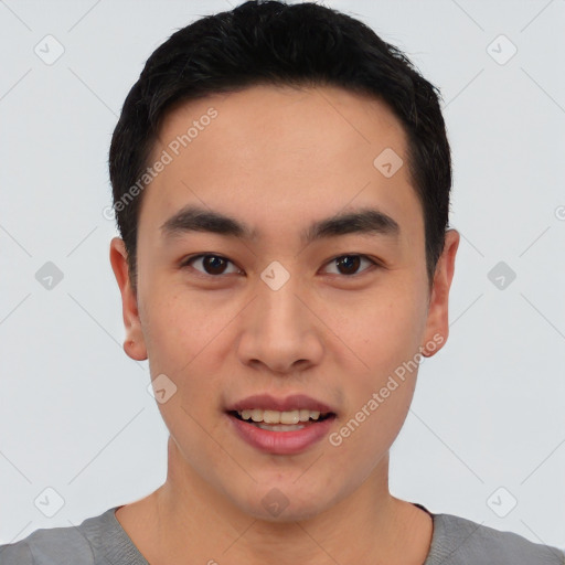 Joyful asian young-adult male with short  black hair and brown eyes