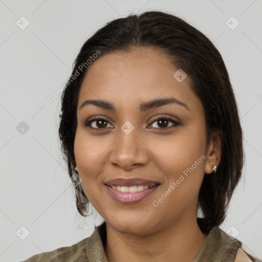 Joyful latino young-adult female with medium  brown hair and brown eyes