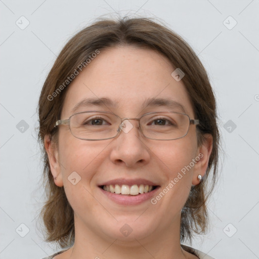 Joyful white adult female with medium  brown hair and grey eyes