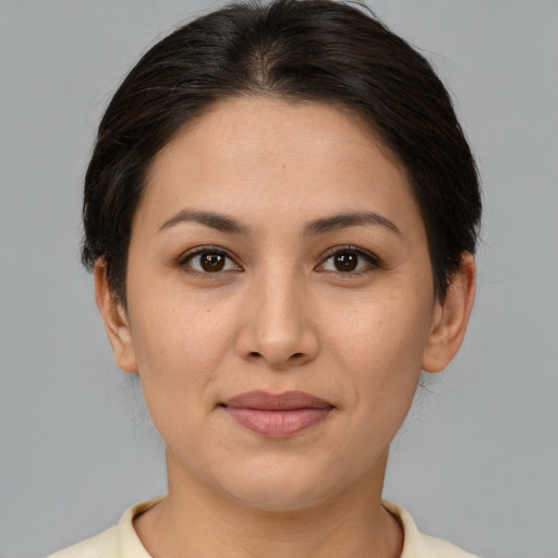 Joyful asian young-adult female with medium  brown hair and brown eyes