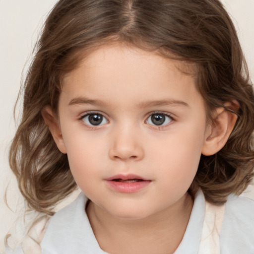 Neutral white child female with medium  brown hair and brown eyes