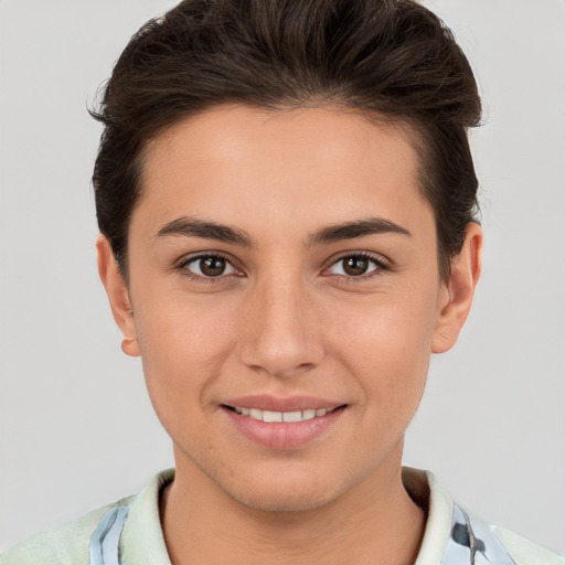 Joyful white young-adult female with short  brown hair and brown eyes