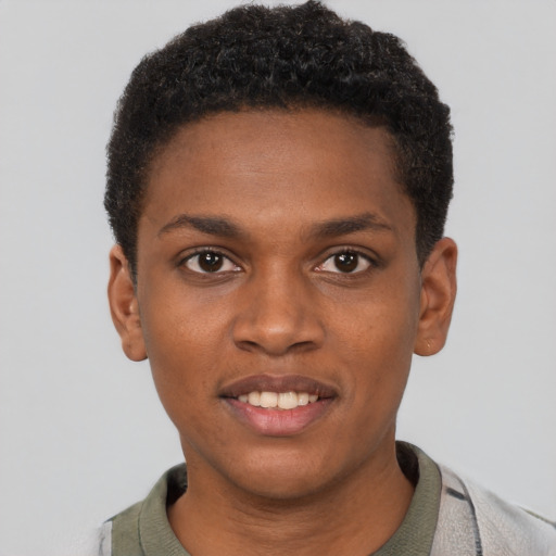 Joyful black young-adult male with short  brown hair and brown eyes